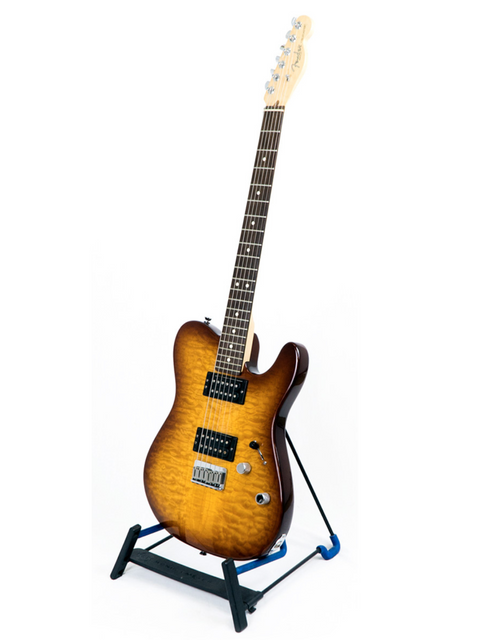 Sunburst electric guitar on a black stand against a white background.